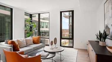 Spacious Living Room with Large Windows at Our Apartments Near Rosslyn Metro Station