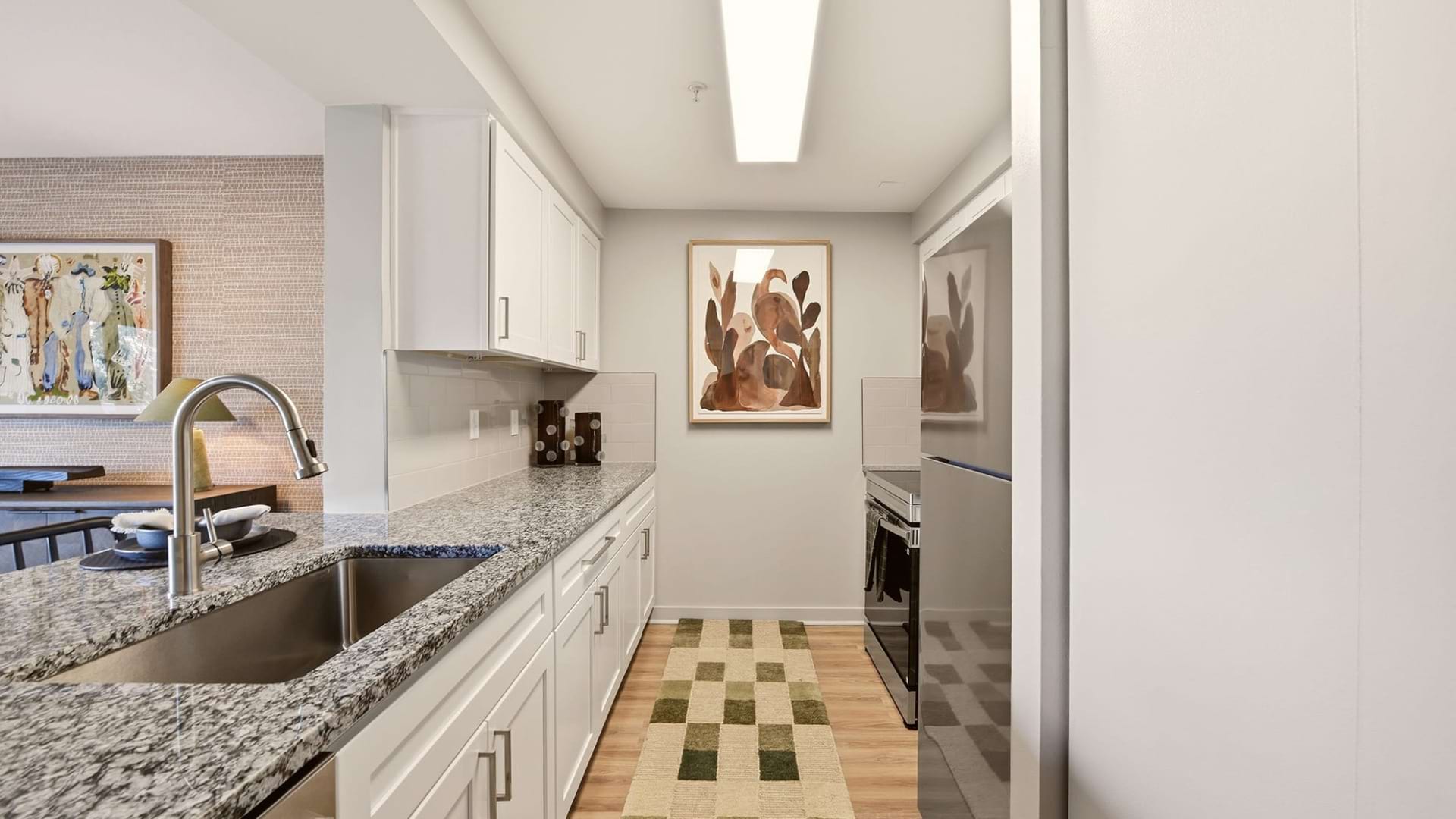 Modern Cabinetry with Designer Hardware and Tile Backsplashes in the Kitchen of Our Apartments for Rent in Springfield, VA