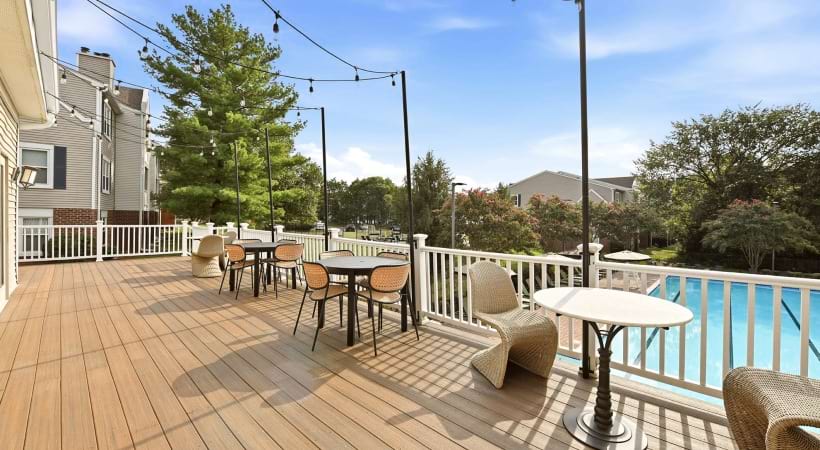Resort-Style Pool and Sun Deck with Shaded Seats at Our Gainesville Apartments in VA
