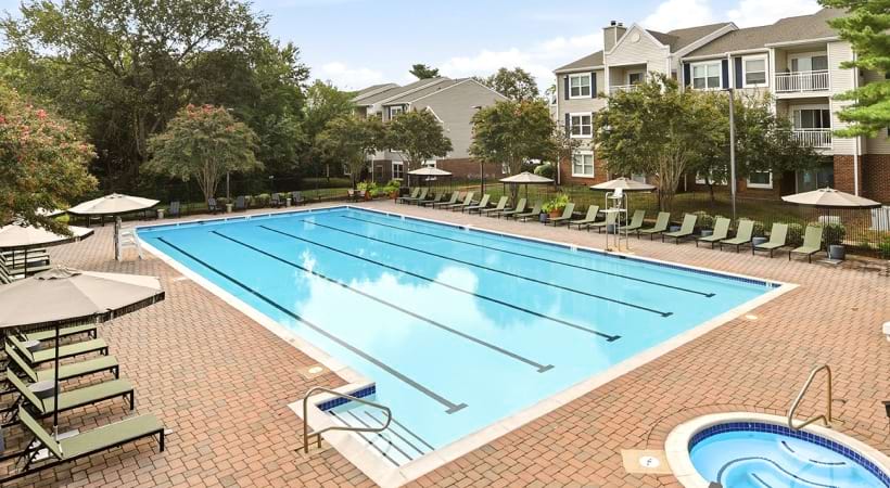Resort-Style Pool and Sun Deck with Lounge Chairs at Our Gainesville, VA Apartments for Rent