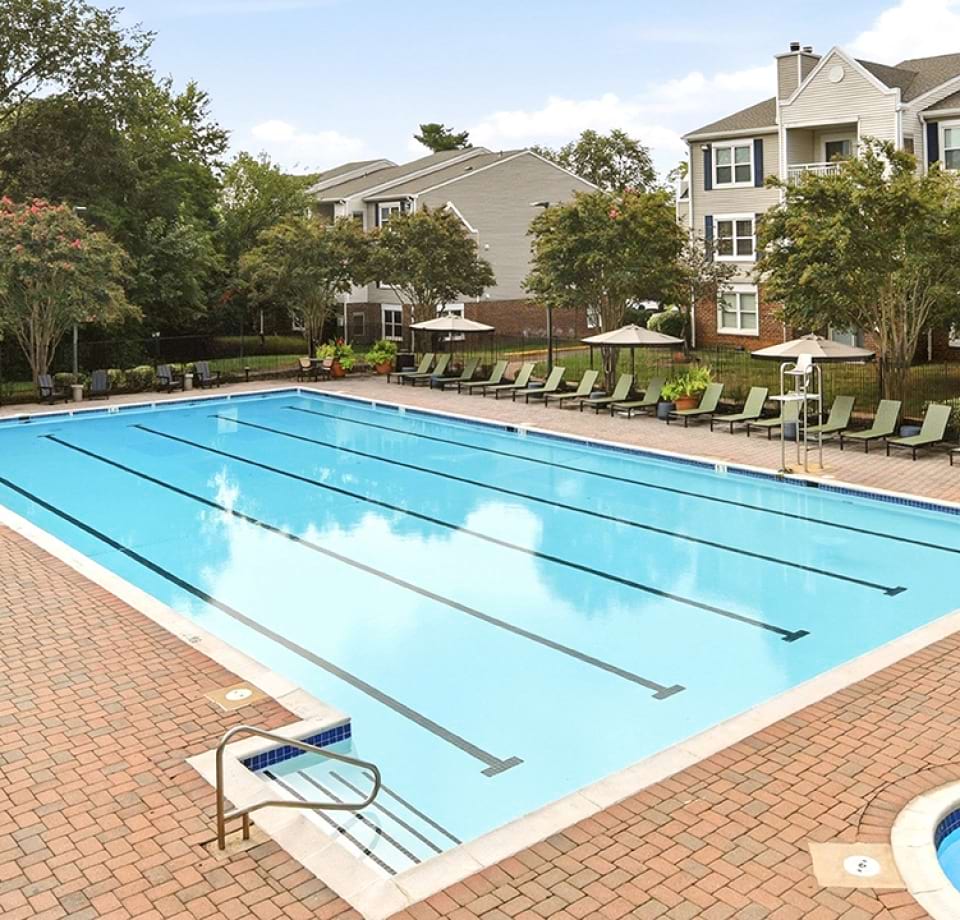 Resort-Style Pool and Sun Deck with Lounger Chairs at Our Apartments in Manassas, Virginia