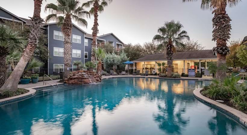 Resort-Style Pool with a Waterfall at Our Cable Ranch Apartments in San Antonio