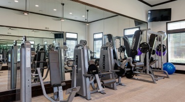 Fitness center at apartments in League City, TX
