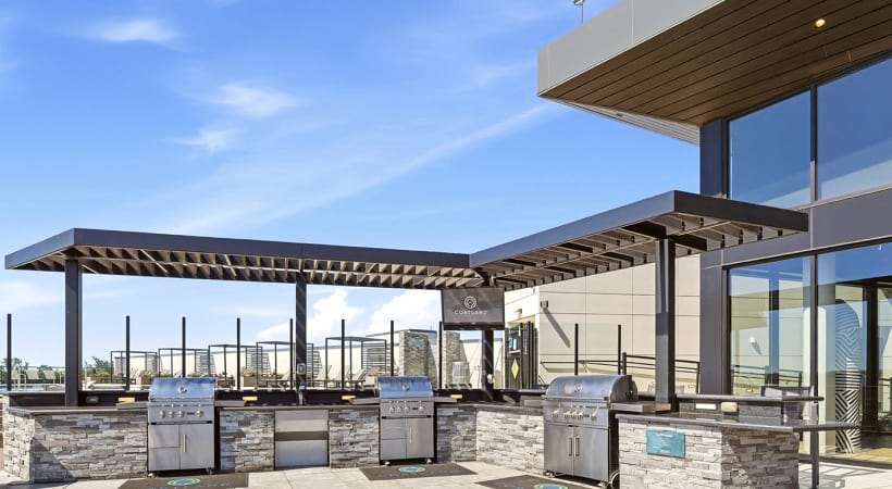 Rooftop Lounge with Gas Grills and Seats at Our DCA Apartment Community
