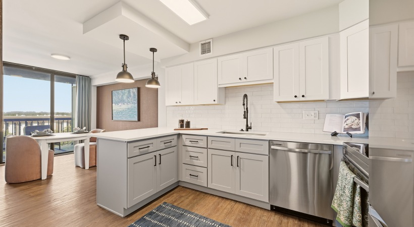 Two-Toned Cabinetry with Designer Hardware and Tile Backsplashes