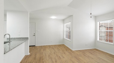 Living Room with Wood-Style Flooring at Our Apartments Near Benbrook 