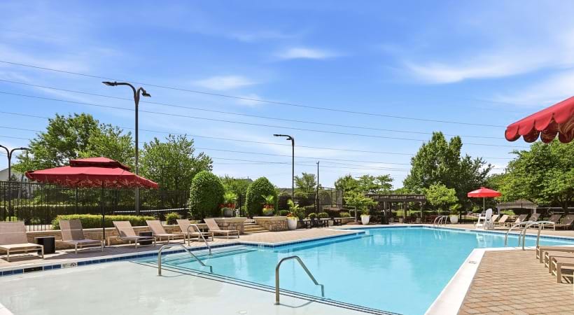 Resort-Style Pool and Sun Deck with Lounge Chairs at Our Coppermine Apartments in Herndon, VA