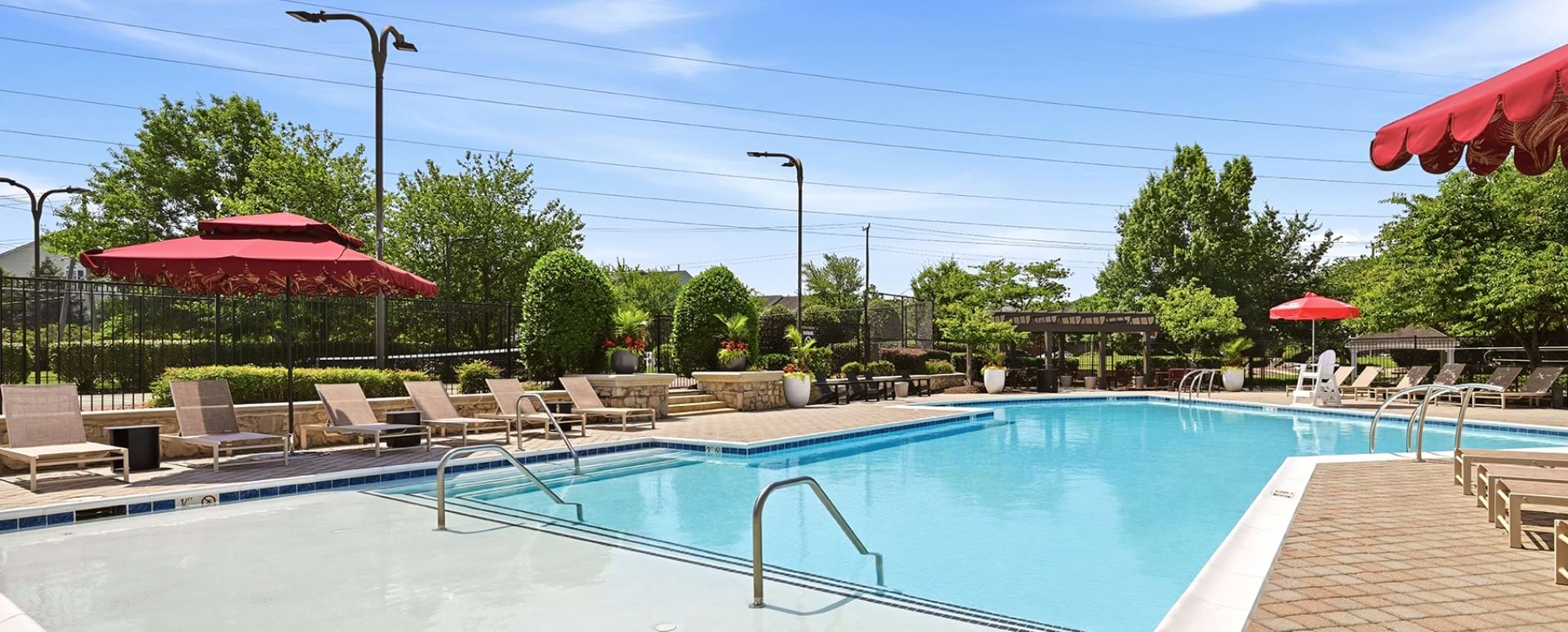  Resort-Style Pool and Sun Deck with Lounge Chairs at Our Dulles Station Apartment Community