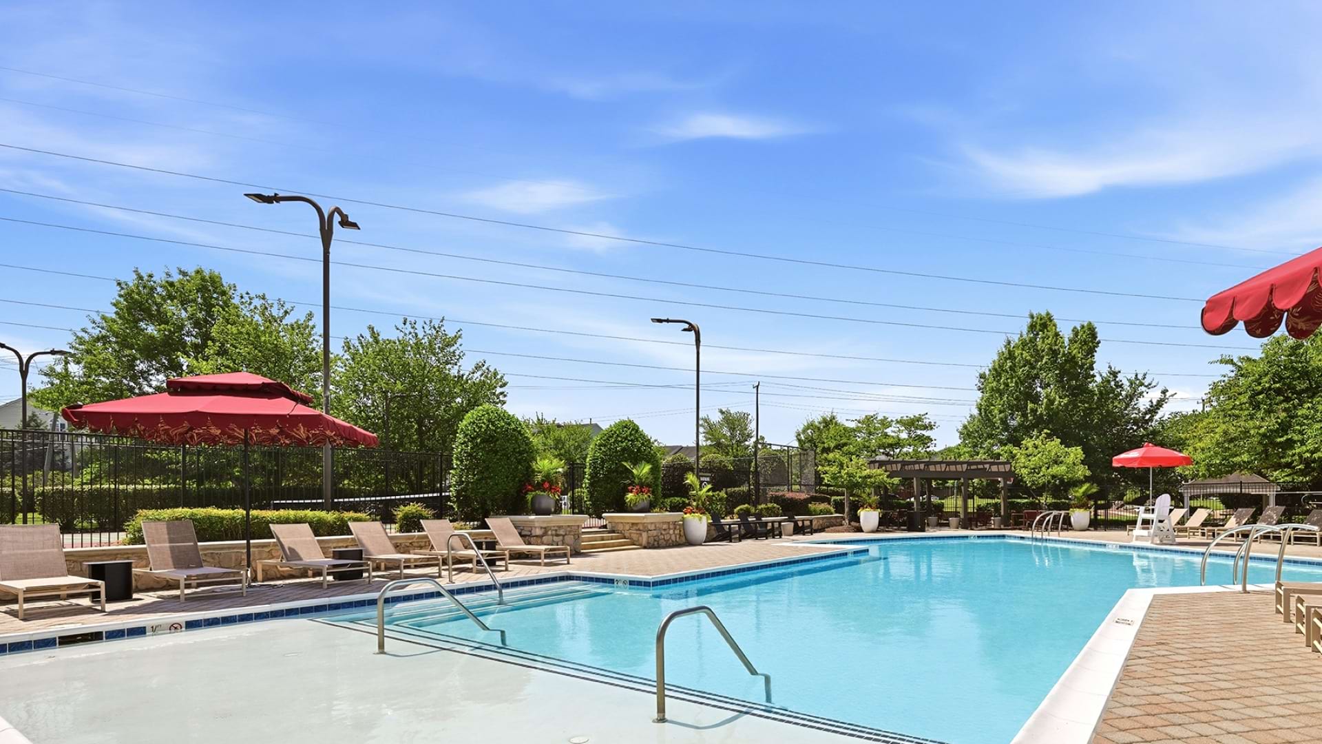 Resort-Style Pool and Sun Deck with Lounge Chairs at Our Apartments for Rent in Herndon, VA
