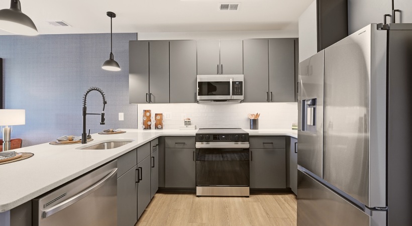 Modern Cabinetry with Under-Cabinet Lighting and Tile Backsplashes