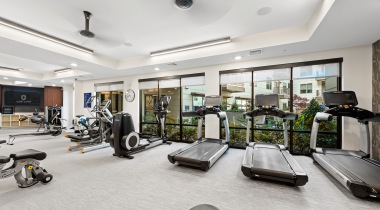 Spacious fitness center with treadmills, rowing machines, and more at our Uptown Charlotte luxury apartments