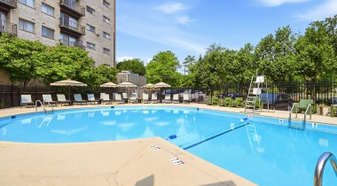 Resort-Style Pool and Sun Deck with Lounge Chairs at Our Apartments on Roosevelt Blvd