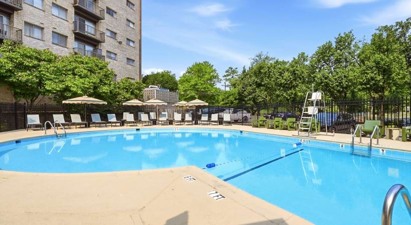 Resort-Style Pool and Sun Deck with Lounge Chairs at Our Apartments on Roosevelt Blvd