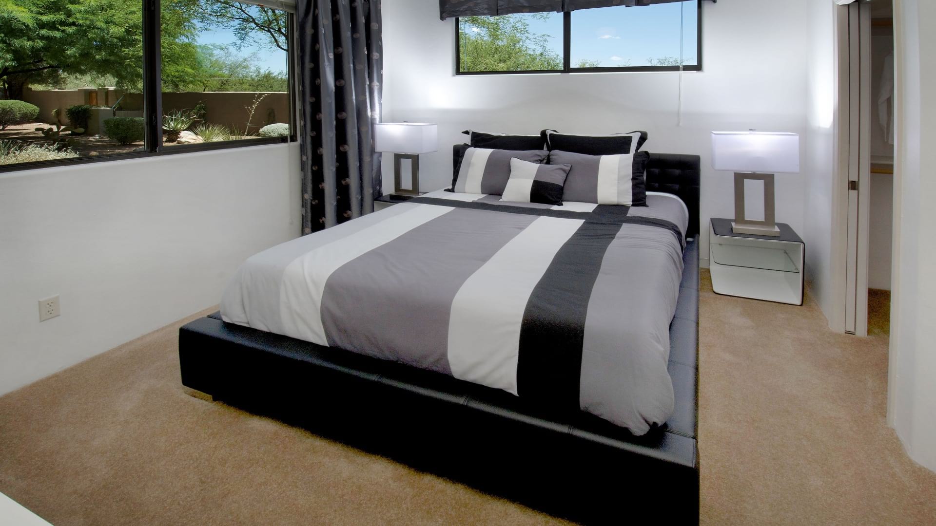 Brightly-Lit, Spacious Bedroom With Multiple Windows At Our Townhomes In Tucson