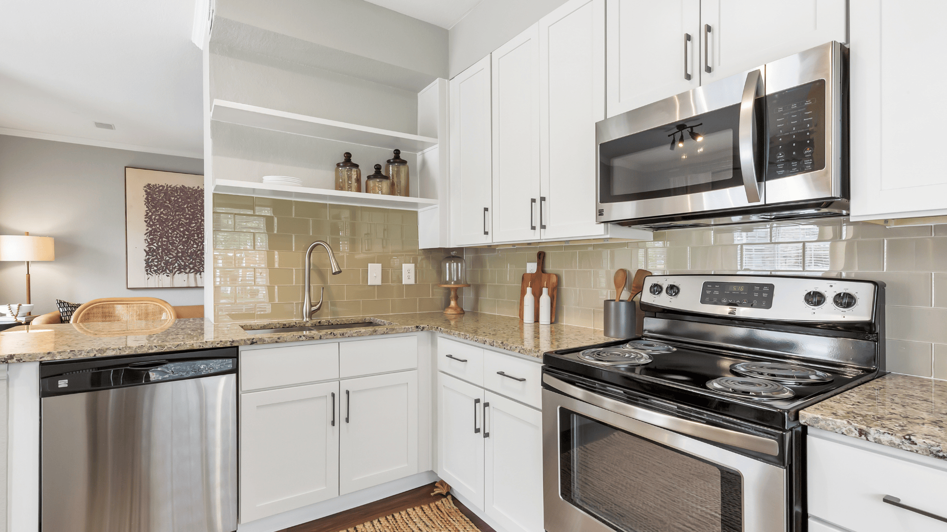 Kitchen with White Cabinets at Our Apartments in Cherry Creek, CO