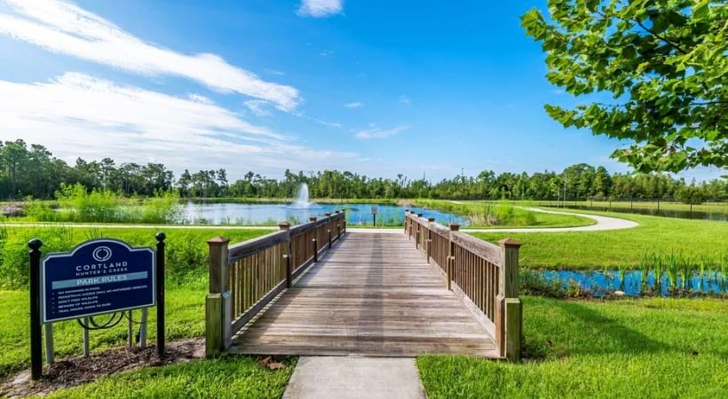 Bridge Crossing the Pond at Our Luxury Apartments Near the Loop