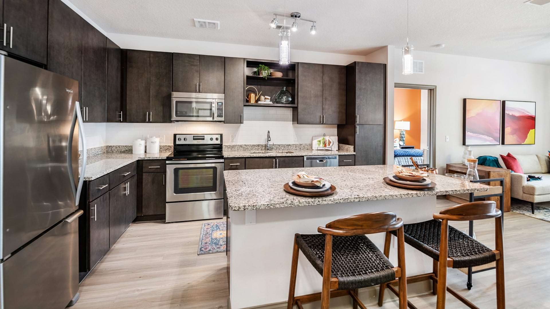 Spacious, Upscale Kitchen With Large Granite Island At Our Apartments In Hunter's Creek, FL