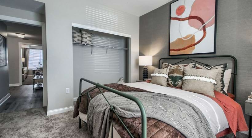 Well-Lit Bedroom at Our Apartments by Tanger Outlet