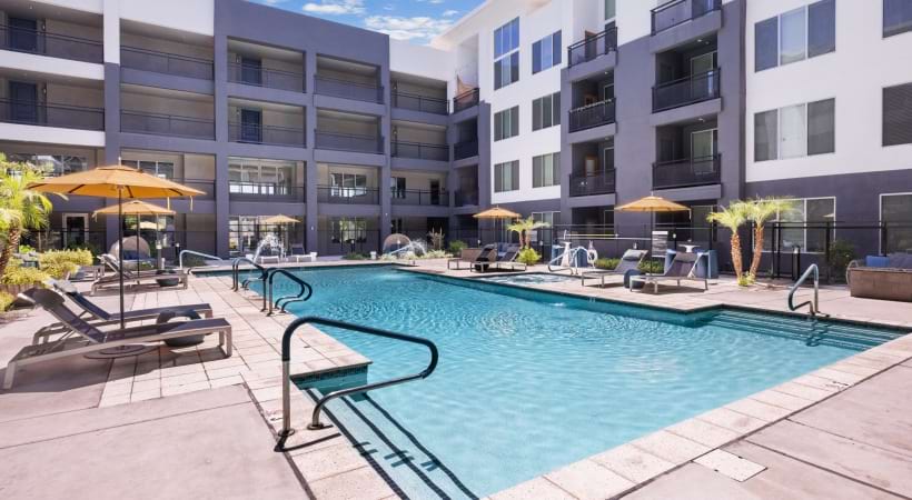 Poolside Lounge with a Fireplace at Our Apartments Near Biltmore
