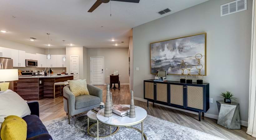 Spacious Living Room with Wood-Style Flooring at Our Apartments near Orlando