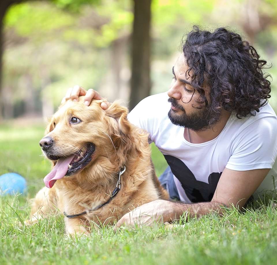 Resident with Their Dog at Our Pet-Friendly Cortland Apartments