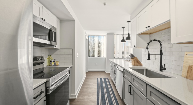 Modern Cabinetry with Designer Hardware and Tile Backsplashes