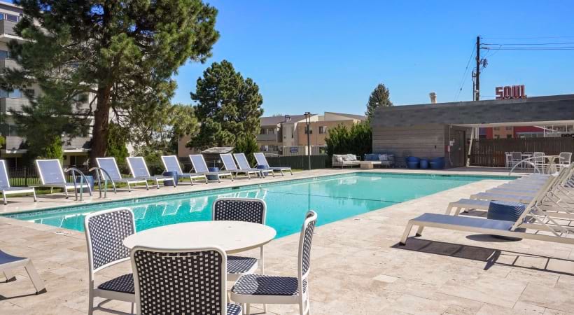 Swimming Pool with Lounge Chairs Nearby at Our Apartments Near Colorado Blvd