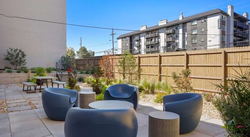 Outdoor Resident Lounge with Seats and Tables at Our Apartments in Cherry Creek, Denver