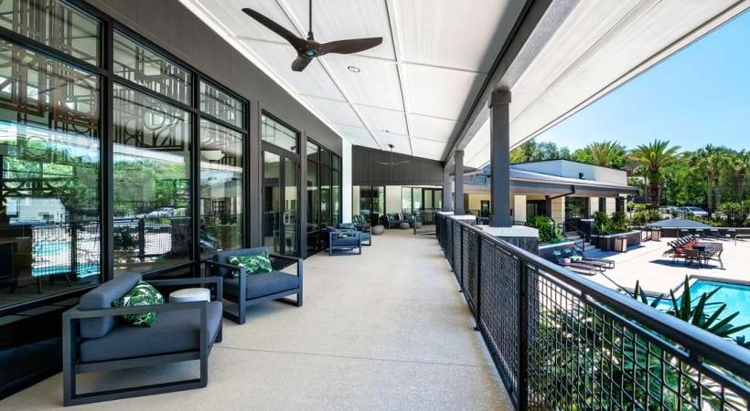 Apartment balcony overlooking the pool at Cortland Mirror Lake
