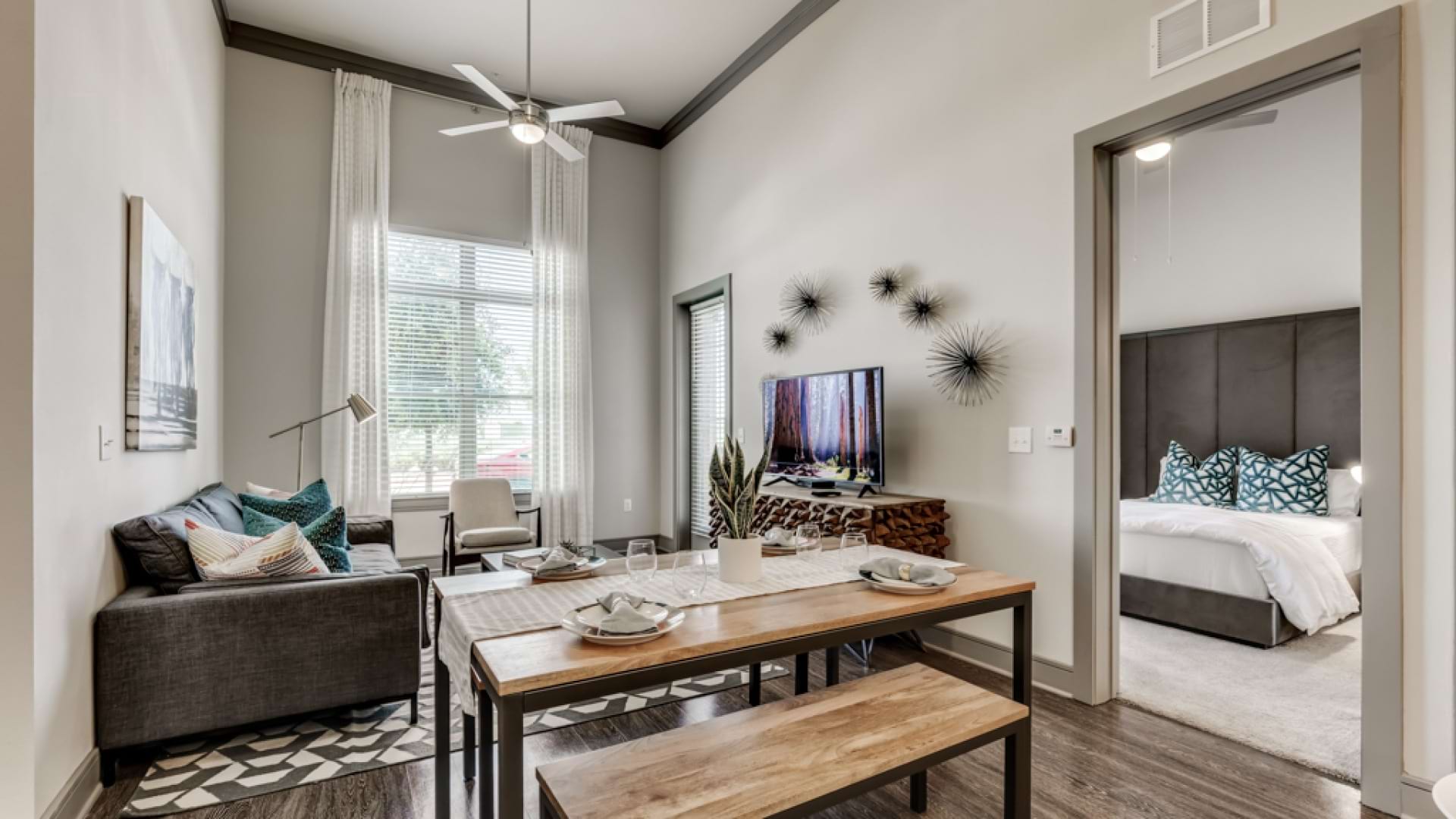 Spacious living room with modern lighting at our apartments for rent in Frisco, TX