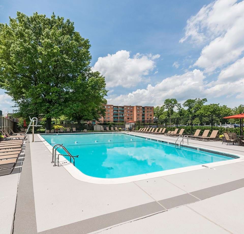 Resort-Style Pool and Sun Deck with Lounge Chairs at Our Apartments Near Georgetown University Washington, DC