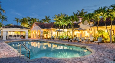Heated, Resort-Style Pool with Lounge Chairs Nearby at Our Luxury Apartments in Boynton Beach