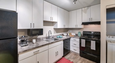 Expansive Kitchen with Granite-Style Countertops at Our Apartments in Downtown Gilbert