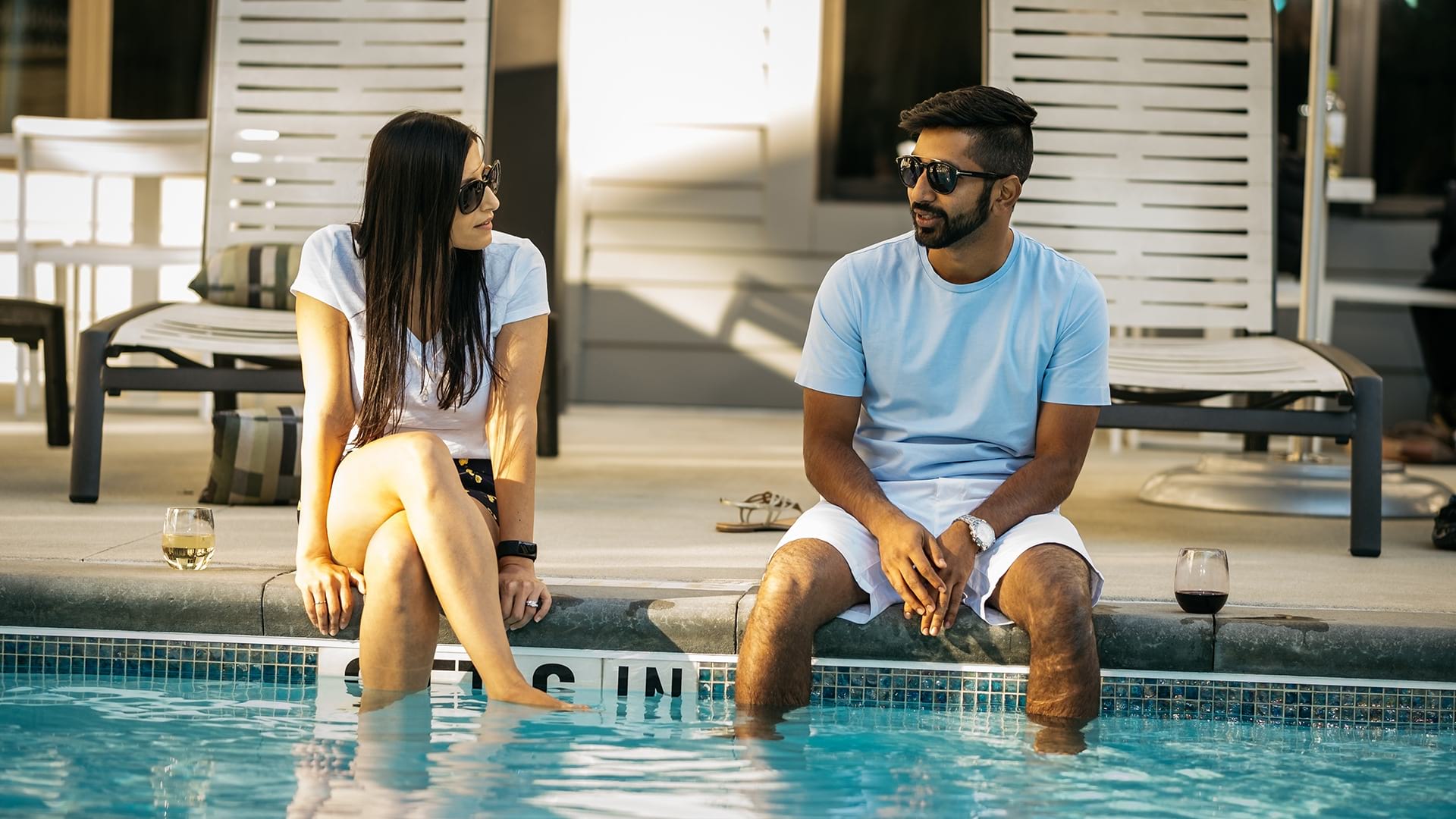 Couple Chatting at the Pool of Our Cortland Apartments
