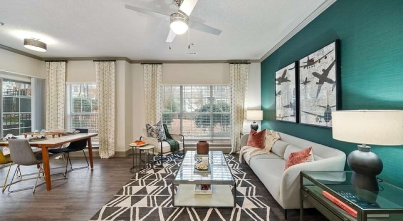 Living Room With Wood-Style Flooring at Our Glenwood Apartments
