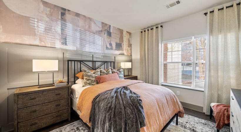 Upscale Bedroom With Cozy Decor at Our Cary Apartments For Rent