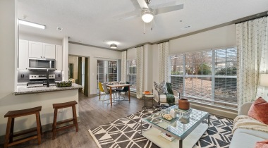  Open-Concept Living Room With Wood-Style Flooring at Our Apartments in Crabtree - Raleigh, NC