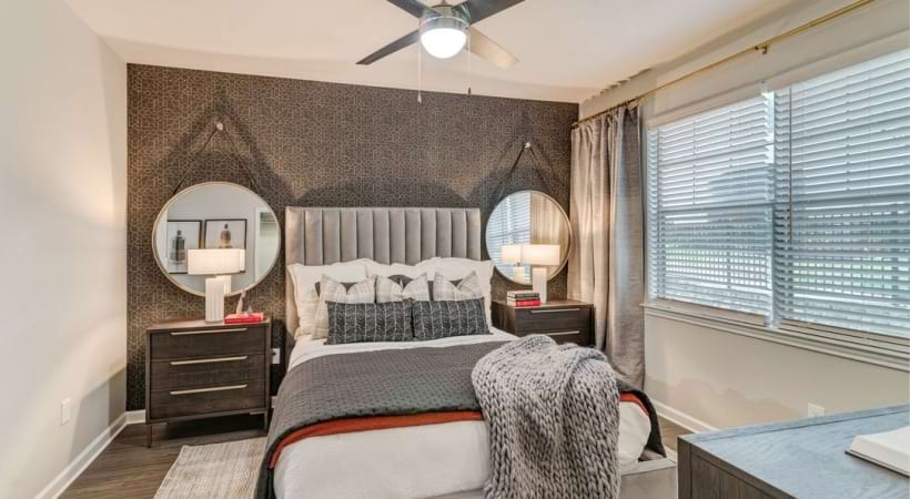 Spacious Bedroom with Ceiling Fan in Our Apartments in Euless, TX