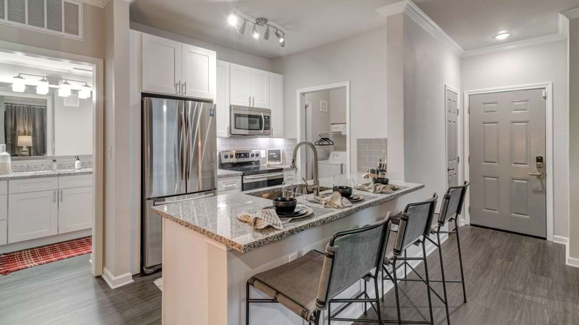Kitchen with Stainless Steel Appliances in Our Bear Creek Apartments in Euless, TX