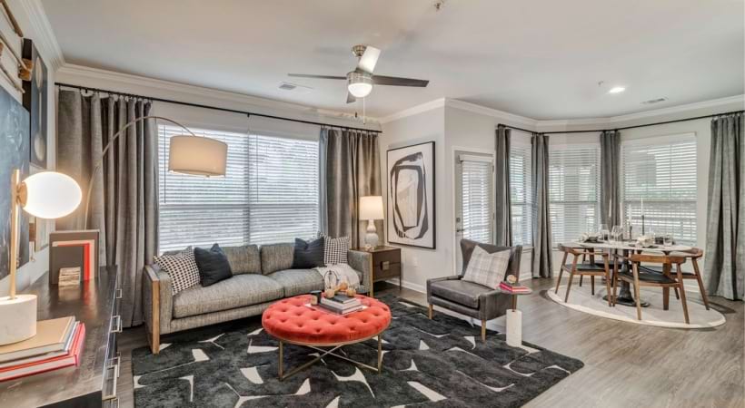 Living and Dining Spaces with Wood-Style Flooring at Our Bear Creek Apartments