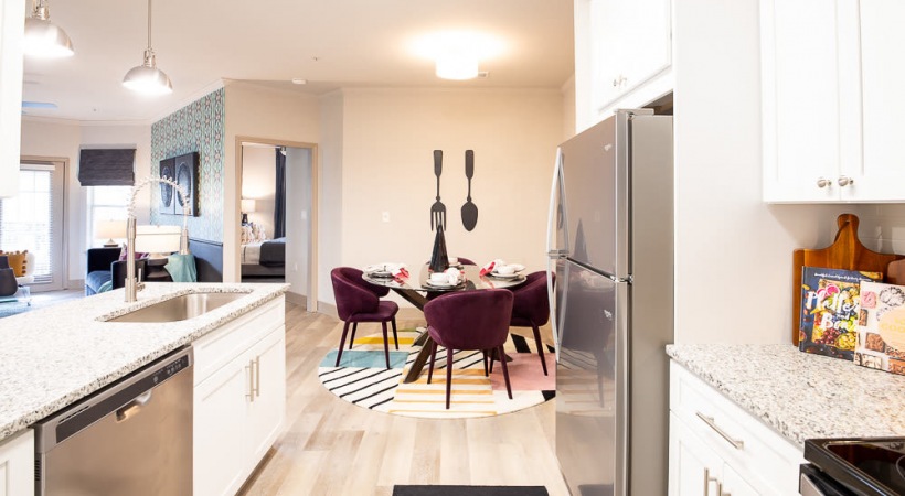 Kitchen and Dining Area with Modern Lighting at Our UNCC Apartments
