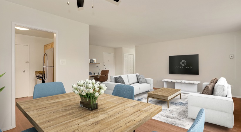 Open Floor Plan Living Room and Dining Area with Wood-Style Flooring at Our Apartments on Columbia Pike