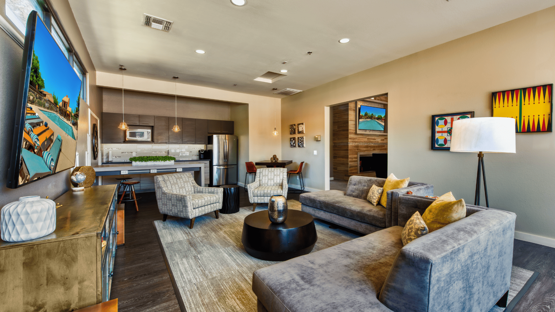 Resident Clubhouse with TVs and a Kitchen Area at Our Gilbert, Arizona Apartments for Rent
