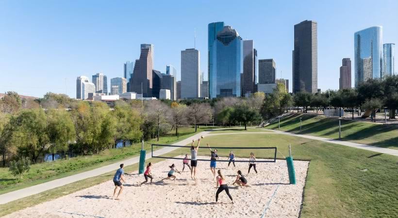 Residents Playing Sand Volleyball Near Our Cortland Apartments