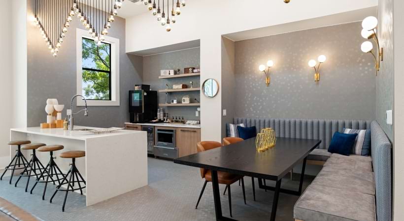 Resident Clubhouse with a Fireplace and HDTV at Our South 1st Apartments