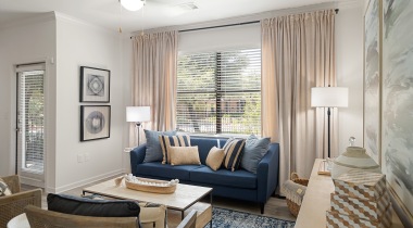 Living Room with Wood-Style Flooring in Our Apartments in Southpark Meadows in Austin