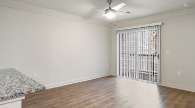 Unfurnished Living Room Area with a Ceiling Fan at Our Apartments in Dulles, VA