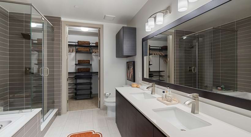 Bathroom with a Double-Sink Vanity in Our Apartments by TSU in Houston