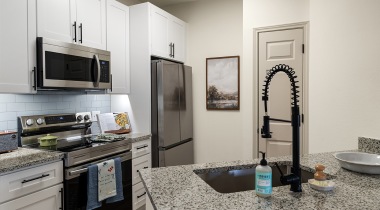 Kitchen with a Breakfast Bar in Our Apartments in Jersey Village Near Houston
