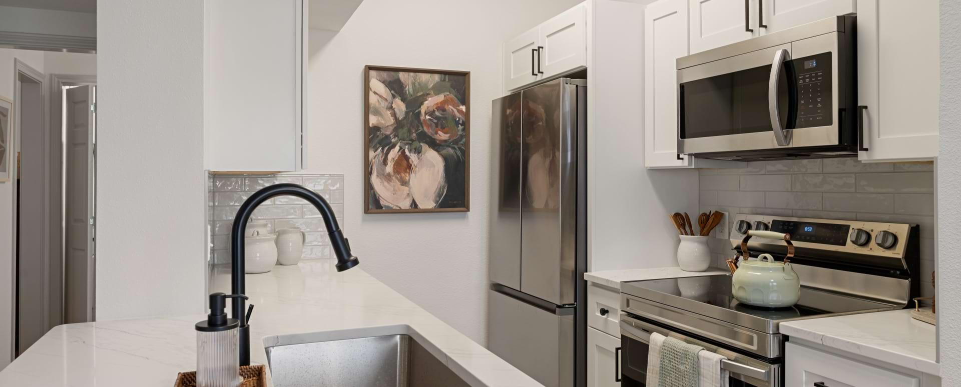 Kitchen with Stainless Steel Appliances in Our Allen Parkway Apartments